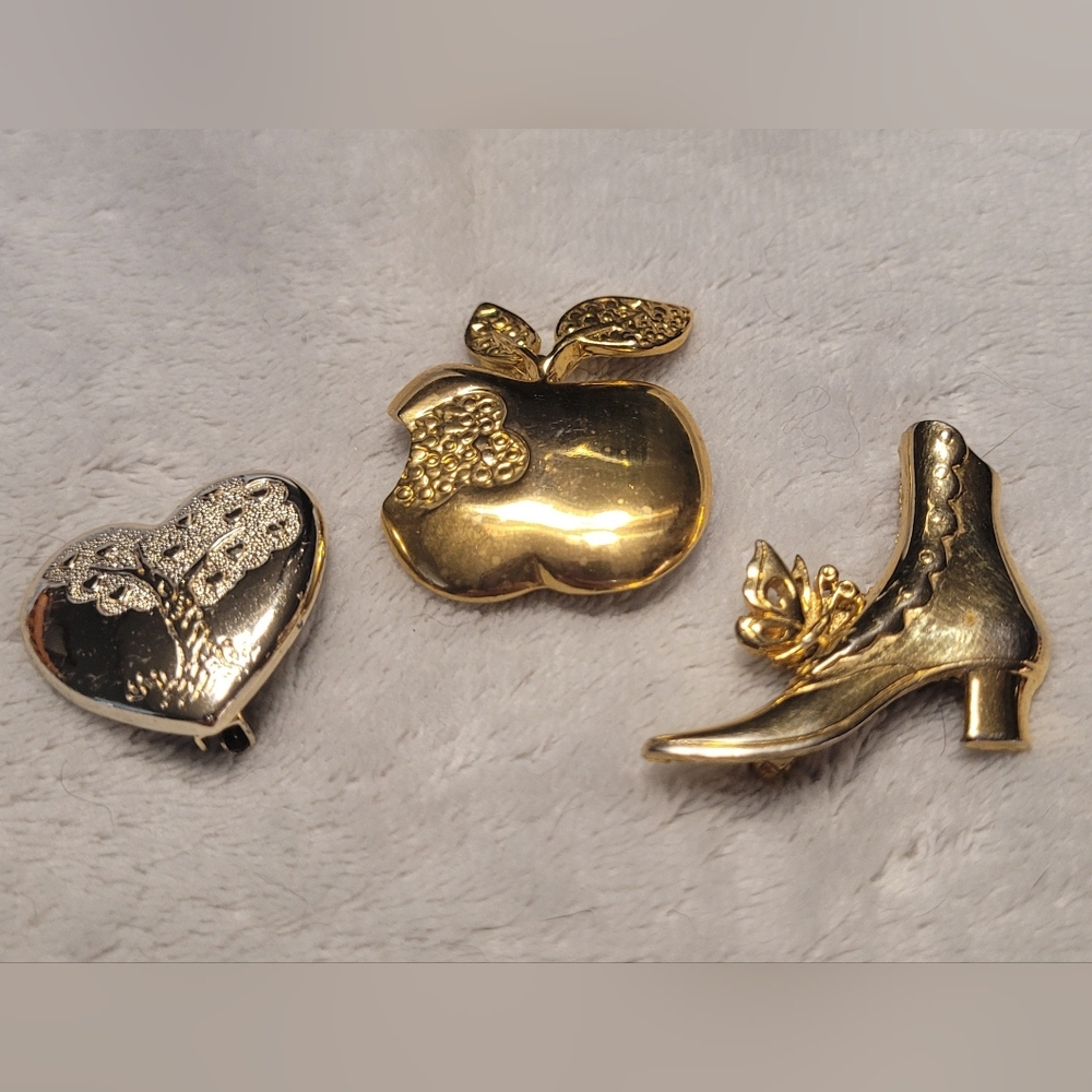 Elegant Gold and Silver Brooch Trio